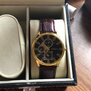 Gold and black Geneva watch